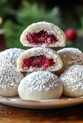 Raspberry Filled Almond Snowball Cookies
